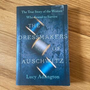 Paperback book “The Dressmaker of Auschwitz” by Lucy Arlington